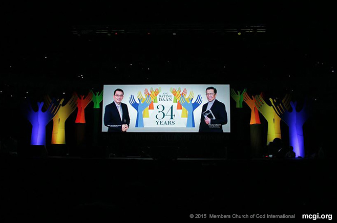 Wide LED screens show  The Old Path's 34th Anniversary logo bearing the photos of MCGI's Overall Servants Bro. Eli Soriano (right) and Bro. Daniel Razon (left). (Photo courtesy of PVI)