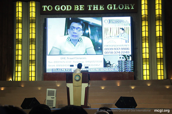 Bro. Daniel Razon looks at the playback of his advice to members of the Church of God International in Visayas to force evacuate before Typhoon Haiyan hit the Philippine Island in November of 2013.