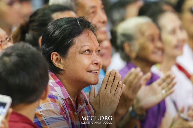 Filipina actress and superstar, Nora Aunor, smiles and claps as she listens intently to the serving of the biblical topic during the 3rd day of the Thanksgiving of God's People event.