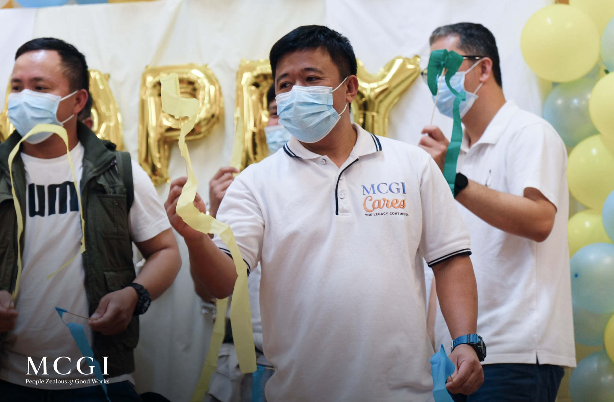 The image shows MCGI brethren offering their thanksgiving to God through singing of songs of praise.